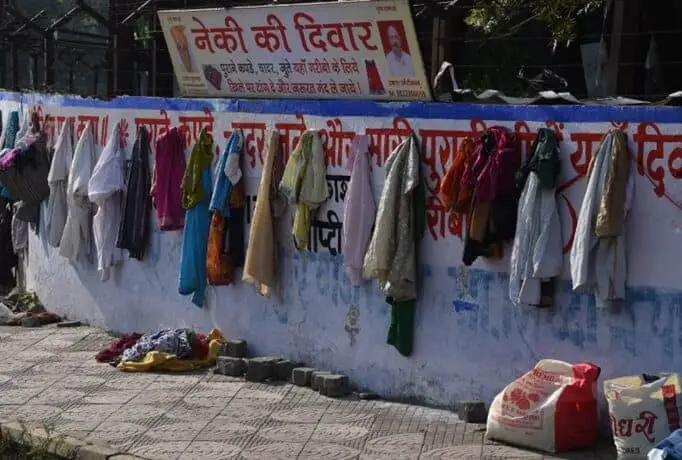 Wall of Kindness in Maheshwar, Madhya Pradesh, India showing a way to fulfill the needs of people